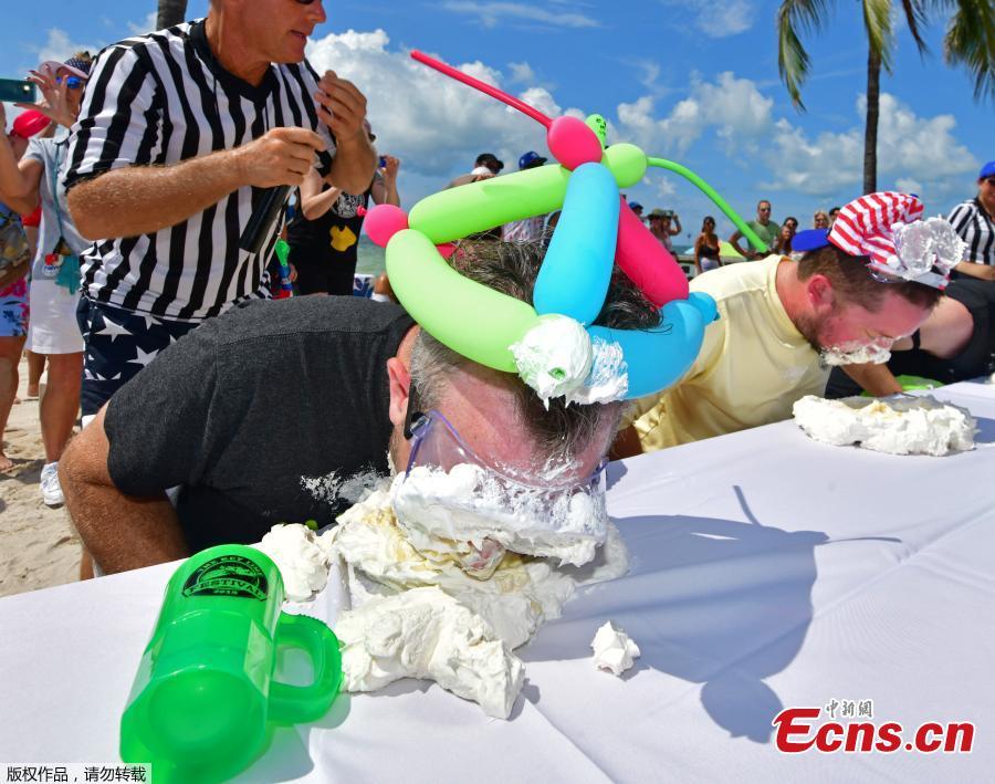 Photo taken on July 4, 2018 shows Trey Bergman, a lawyer of Houston, won Key West\'s annual Key lime pie eating contest for the second year in a row, scarfing down the signature Florida dessert in less than two minutes. Without using his hands, Trey Bergman defeated 24 other contenders for the title. Clad in protective googles and a \