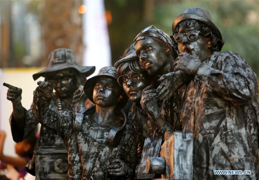 Artists perform during the International Festival of Living Statues in Rehovot, Israel, on July 4, 2018. The International Festival of Living Statues is held in Rehovot from July 3 to July 5. (Xinhua/Gil Cohen Magen)