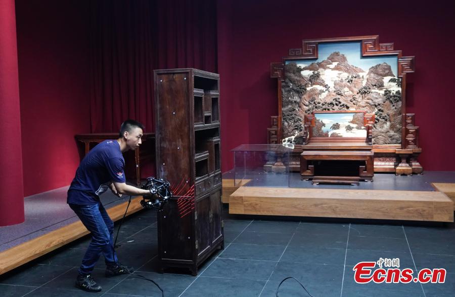 Photo taken on July 6, 2018 shows preparations underway to open the Nanxun Hall area in Nandaku, or the southern grand warehouse, at the Palace Museum, Beijing. The area will be used as a gallery to display imperial furniture in the Kangxi, Qianlong and Yongzheng periods of the Qing Dynasty (1644-1911) in the first stage, and then furniture from the Ming Dynasty (1368-1644) later, eventually bringing the total number of exhibits to 2,000. (Photo: China News Service/Du Yang)