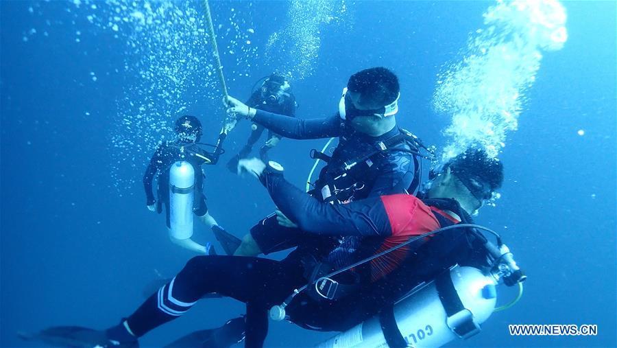 A rescue team search for victims in Phuket, Thailand, July 6, 2018. At least 33 passengers were killed and 23 others still missing after two boats carrying some 133 tourists capsized in rough sea waters in southern Thailand, Governor of Thailand\'s Phuket Province Norraphat Plodthong said on Friday. (Xinhua)