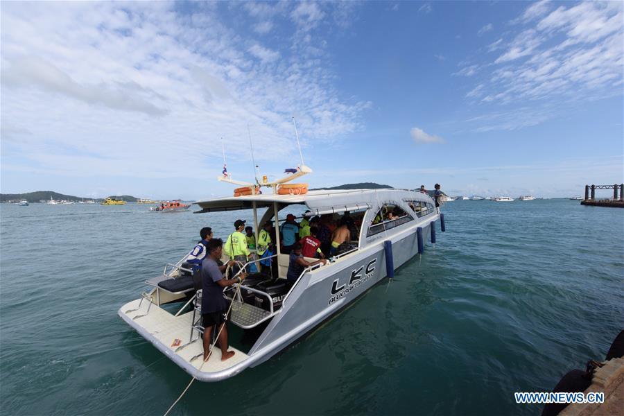 A rescue team departure from a dock to the accident area in Phuket, Thailand, July 6, 2018. At least 33 passengers were killed and 23 others still missing after two boats carrying some 133 tourists capsized in rough sea waters in southern Thailand, Governor of Thailand\'s Phuket Province Norraphat Plodthong said on Friday. (Xinhua/Qin Qing)