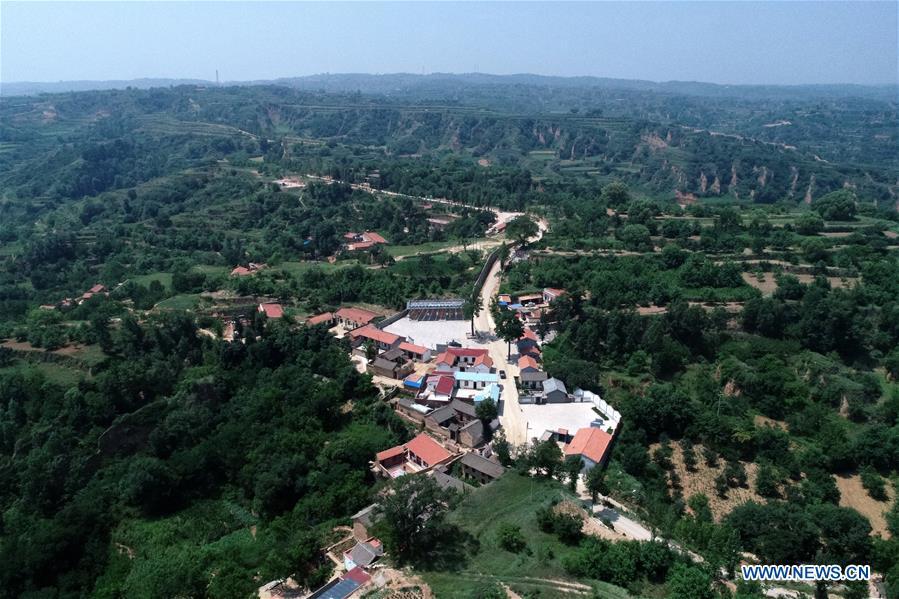 Aerial photo shows Lingtou Village of Wuxiang County, north China\'s Shanxi Province, July 5, 2018. Online business helped villagers sell their farm products, significantly increasing the average incomes of local residents in Lingtou Village. (Xinhua/Zhan Yan)