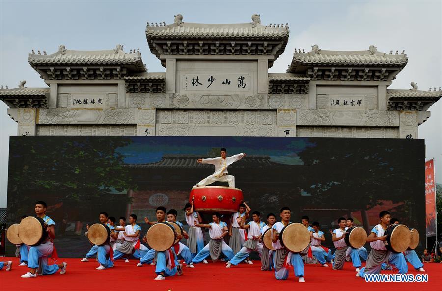 Performers stage a martial arts performance at Shaolin Temple on the Mount Songshan, central China\'s Henan Province, July 7, 2018. (Xinhua/Li Jianan)