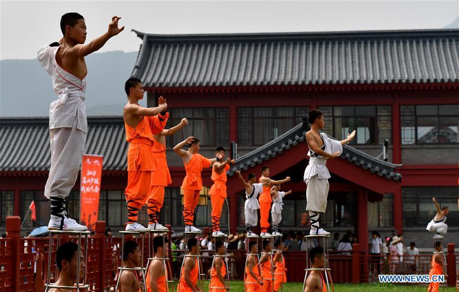 Performers stage a martial arts performance at Shaolin Temple on the Mount Songshan, central China\'s Henan Province, July 7, 2018. (Xinhua/Li Jianan)
