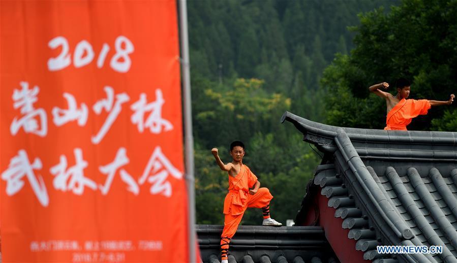 Performers stage a martial arts performance at Shaolin Temple on the Mount Songshan, central China\'s Henan Province, July 7, 2018. (Xinhua/Li Jianan)