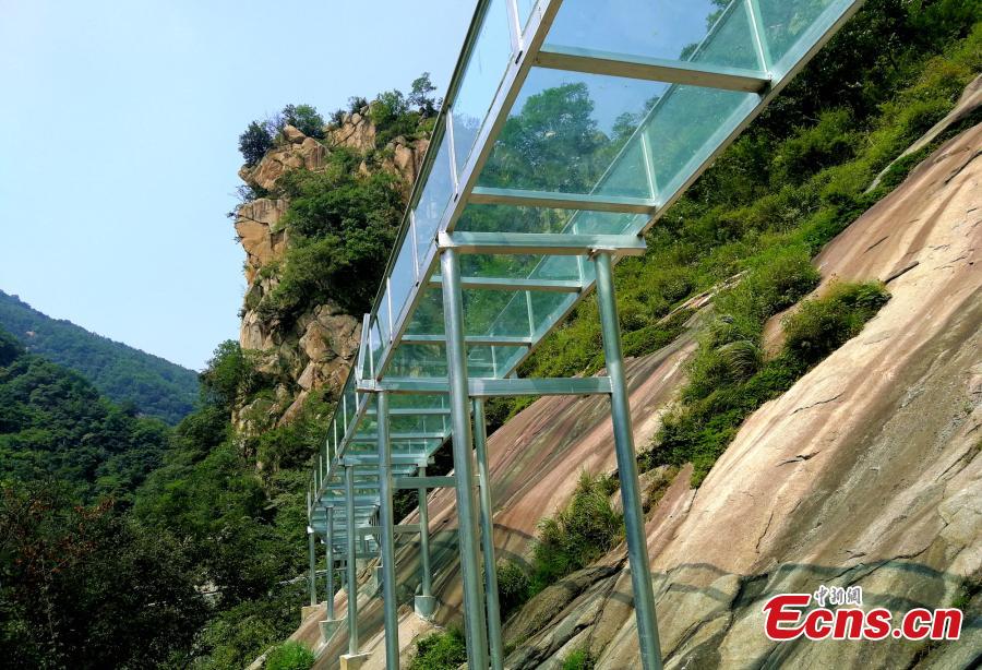 An aerial view of a waterslide over the Xiangma River in Lushan County, Central China’s Henan Province, July 9, 2018. The 2.3-kilometer-long waterside under construction around a mountain slope and cliff has a vertical drop of 100 meters, earning it the title of the longest and most challenging waterslide in central China. (Photo: China News Service/Dong Fei)