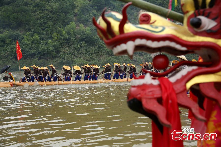 Miao people celebrate the dragon boat festival in Qingshui River, Taijiang County, Southwest China’s Guizhou Province, July 8, 2018. The dragon boat of the Miao is rather special. It is commonly made from a large fir or phoenix tree. Before the contest, villagers will offer chicken and duck to pray for luck and prosperity. The local festival was recognized as a national intangible cultural heritage in 2008. (Photo: China News Service/Huang Xiaohai)