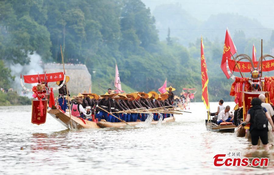 Miao people celebrate the dragon boat festival in Qingshui River, Taijiang County, Southwest China’s Guizhou Province, July 8, 2018. The dragon boat of the Miao is rather special. It is commonly made from a large fir or phoenix tree. Before the contest, villagers will offer chicken and duck to pray for luck and prosperity. The local festival was recognized as a national intangible cultural heritage in 2008. (Photo: China News Service/Huang Xiaohai)