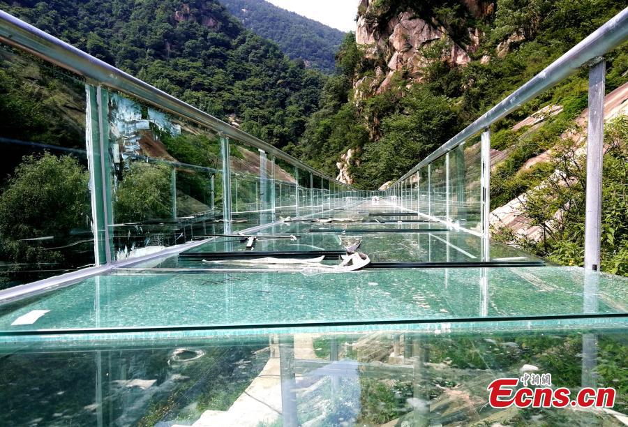 An aerial view of a waterslide over the Xiangma River in Lushan County, Central China’s Henan Province, July 9, 2018. The 2.3-kilometer-long waterside under construction around a mountain slope and cliff has a vertical drop of 100 meters, earning it the title of the longest and most challenging waterslide in central China. (Photo: China News Service/Dong Fei)