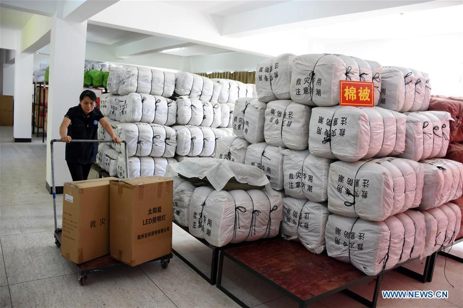 An official prepares relief materials at Yongding District of Longyan City, southeast China\'s Fujian Province, July 9, 2018. A yellow-level alert has been issued and third-level emergency response has been activated to cope with approaching typhoon Maria, the eighth typhoon this year, in China\'s coastal provinces. (Xinhua/Su Gaolong)