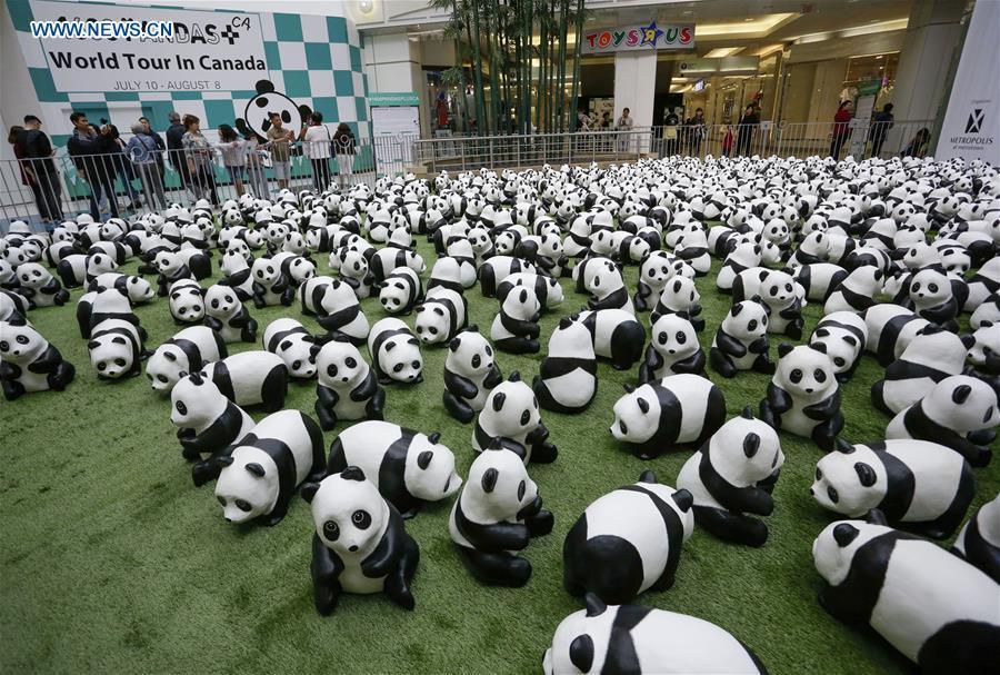 Photo taken on July 10, 2018 shows papier-mache pandas during an exhibition of the papier-mache artwork \
