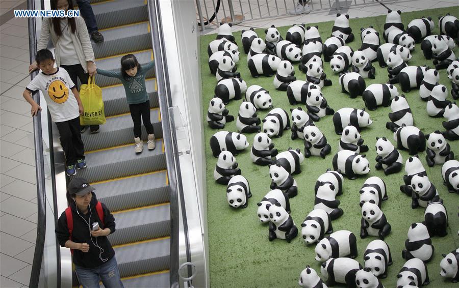 Photo taken on July 10, 2018 shows papier-mache pandas during an exhibition of the papier-mache artwork \