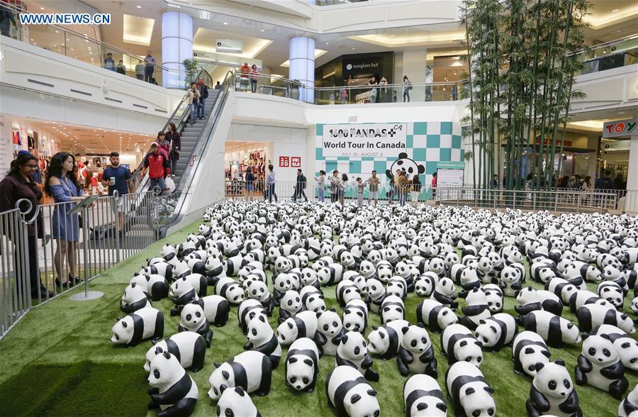 Photo taken on July 10, 2018 shows papier-mache pandas during an exhibition of the papier-mache artwork \