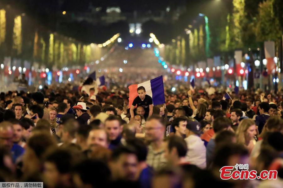 France fans react on the Champs-Elysees in Paris, France, July 10, after defeating Belgium 1-0 in their World Cup semi-final match in St Petersburg. It means the 1998 World Cup winners will play either England or Croatia in the final on Sunday. (Photo/Agencies)