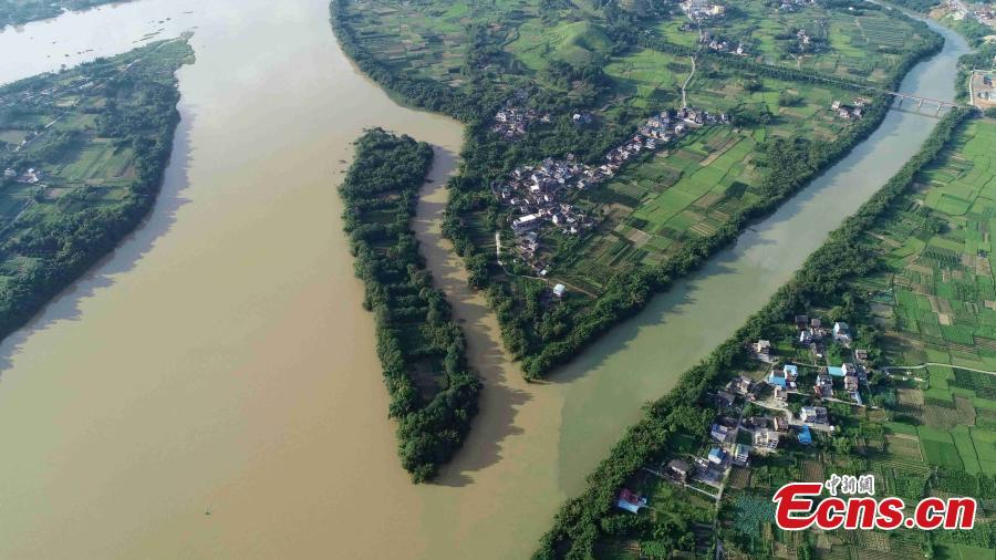 An aerial view of muddy water mixing with clean after strong rainfall in Rong’an County, South China’s Guangxi Zhuang Autonomous Region, July 10, 2018. (Photo: China News Service/Tan Kaixing)