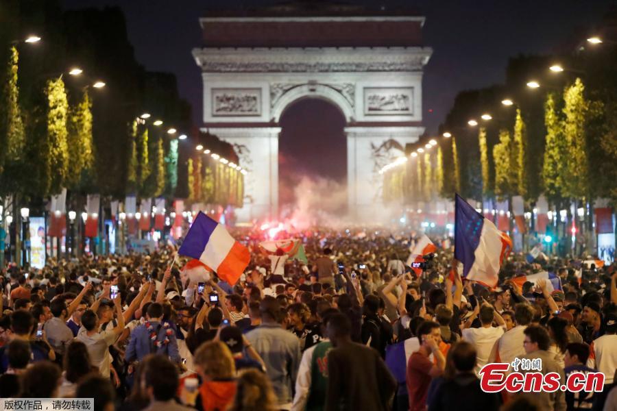 France fans react on the Champs-Elysees in Paris, France, July 10, after defeating Belgium 1-0 in their World Cup semi-final match in St Petersburg. It means the 1998 World Cup winners will play either England or Croatia in the final on Sunday. (Photo/Agencies)