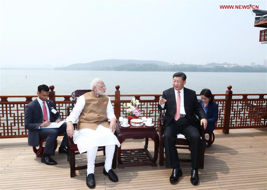 April 28, 2018 

President Xi Jinping talks with Indian Prime Minister Narendra Modi in Wuhan, Central China\'s Hubei Province, ahead of the start of the Shanghai Cooperation Organization summit in June and at an important juncture for the progress of China-India relations. (Photo/Xinhua)

During the meeting, Xi and Modi tried two types of local tea, Lichuan black tea and Enshi green tea. Xi also mentioned that another type of tea from Yichang, Hubei, had ties with India. With exchanges between China and India in trade and culture dating far back, President Xi emphasized that China and India should expand and deepen exchanges, be committed to the rejuvenation of Eastern civilization, call for respect for cultural diversity, and promote the harmonious coexistence of different civilizations.