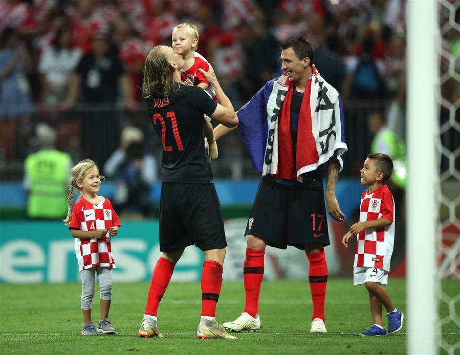 Croatia\'s Domagoj Vida (2nd L) and Mario Mandzukic (2nd R) celebrate victory after the 2018 FIFA World Cup semi-final match between England and Croatia in Moscow, Russia, July 11, 2018. Croatia won 2-1 and advanced to the final. (Xinhua/Wu Zhuang)