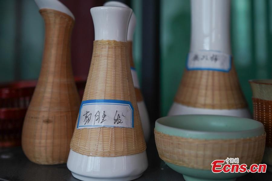 Bamboo works are on display in Yang Dujuan’s workshop in Sansui County, Southwest China’s Guizhou Province, July 11, 2018. A former migrant worker, Yang began to lead other villagers to make bamboo creations in 2014, trained more than 300 locals, and has now reached annual sales surpassing one million yuan ($150,000). In 2018, she began offering bamboo strips made into QR codes for clients, a creative combination of traditional bamboo weaving and the emerging popularity of codes that smartphone users can scan to access rich information. Her creation priced at 200 yuan for products was popular online. (Photo: China News Service/He Junyi)