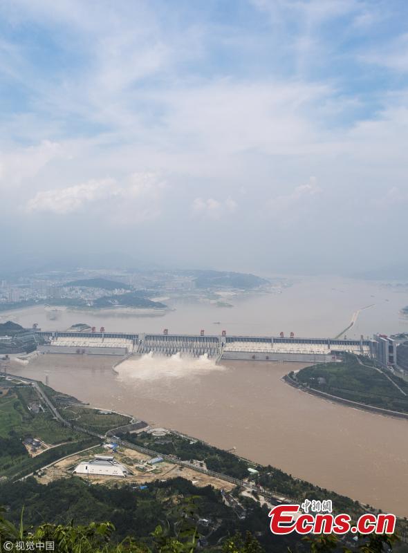 Water gushes out of the Three Gorges Dam in Yichang City, Central China’s Hubei Province. On July 14, the Three Gorges Reservoir will receive a massive 60, 000 cubic meters of water a second due to heavy rain in the upper reaches of the Yangtze River. Authorities have issued a flood alert in several provinces along the river. (Photo/VCG)