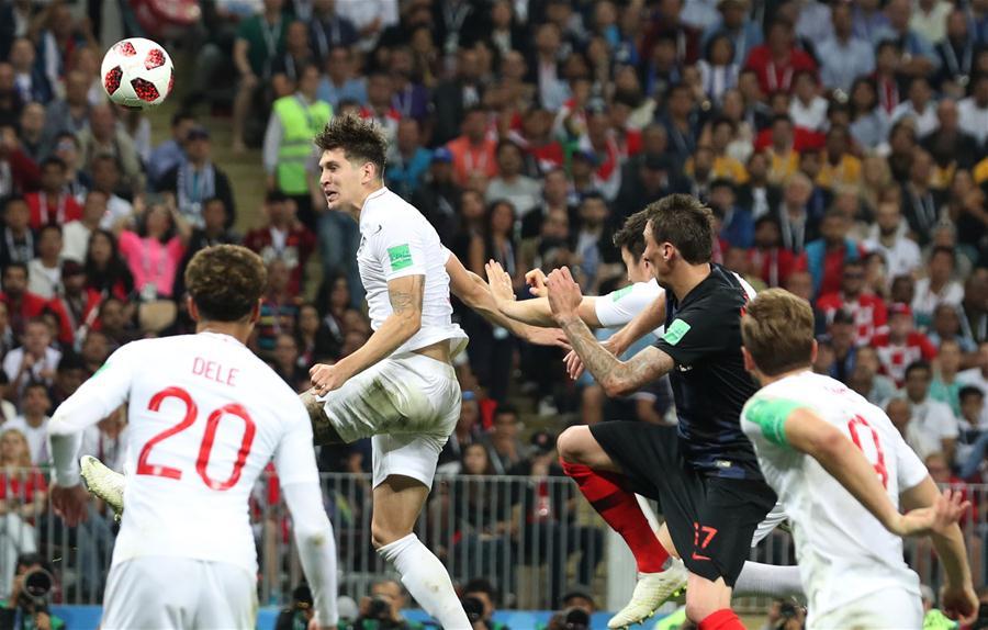 John Stones (top) of England competes for a header during the 2018 FIFA World Cup semi-final match between England and Croatia in Moscow, Russia, July 11, 2018. (Xinhua/Cao Can)