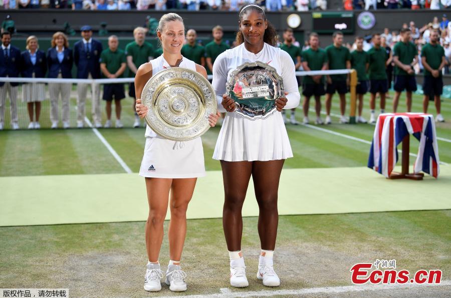 Germany\'s Angelique Kerber and Serena Williams of the U.S. hold their trophies after Kerber won the women\'s singles final, at the Wimbledon Tennis Championships, in London, Britain, July 14, 2018. (Photo/Agencies)