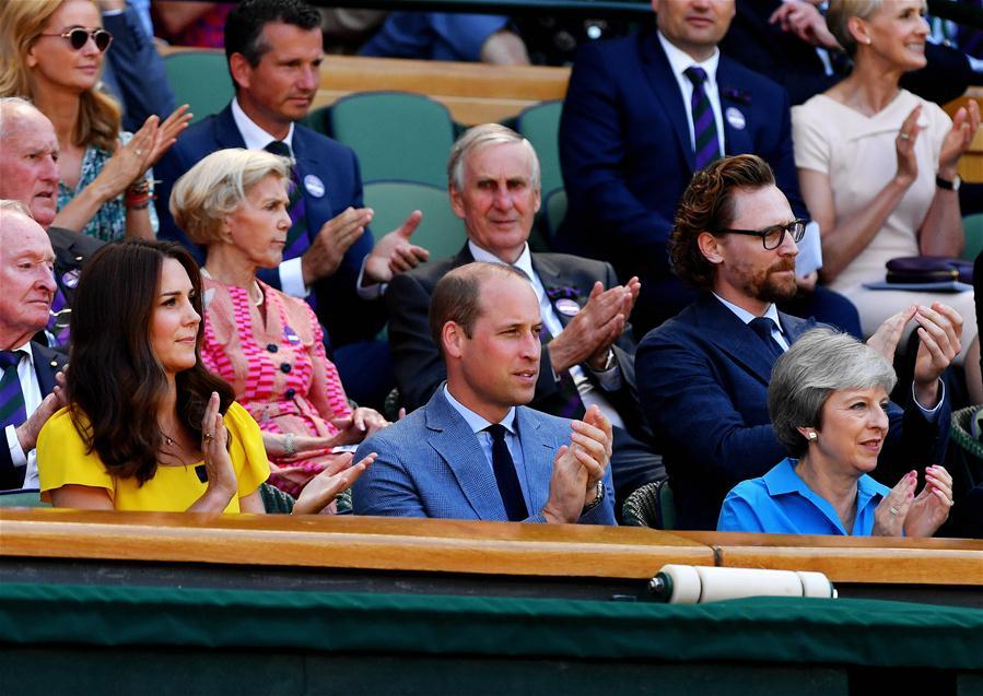 British Prime Minister Theresa May (Front, R), Prince William (Front, C), Duke of Cambridge, and his wife Catherine(Front, L), Duchess of Cambridge, are seen during the men\'s singles final match between Novak Djokovic of Serbia and Kevin Anderson of South Africa at the Wimbledon Championships 2018 in London, Britain, on July 15, 2018. (Xinhua/Guo Qiuda)