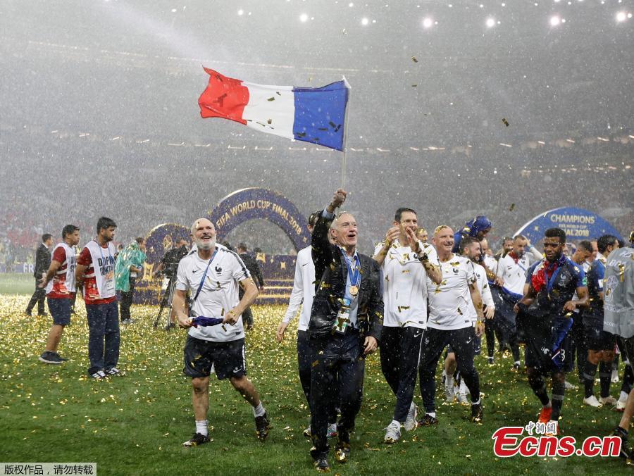 France coach Didier Deschamps and backroom staff celebrate winning the World Cup at Luzhniki Stadium in Moscow, Russia, July 15, 2018. (Photo/Agencies)