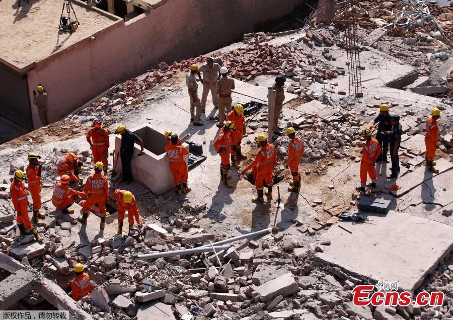 Rescue workers look for survivors amidst the rubble at the site of a collapsed residential building at Shah Beri village in Greater Noida, India, July 18, 2018. Police said that most of the people feared trapped are laborers working at the site. India Today reported that a National Disaster Response Force (NDRF) team has also been rushed to the spot. The news channel further said that as many as 20 people are feared trapped in the debris. (Photo/Agencies)