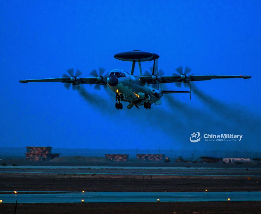 An airborne early warning (AEW) aircraft takes off at night for a sortie during the \