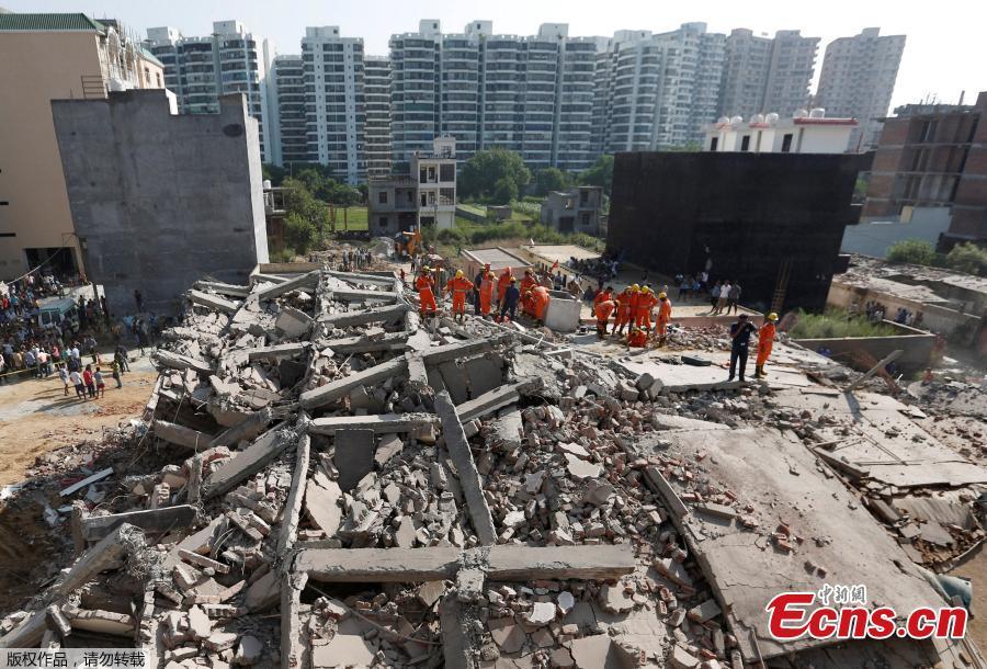 Rescue workers look for survivors amidst the rubble at the site of a collapsed residential building at Shah Beri village in Greater Noida, India, July 18, 2018. Police said that most of the people feared trapped are laborers working at the site. India Today reported that a National Disaster Response Force (NDRF) team has also been rushed to the spot. The news channel further said that as many as 20 people are feared trapped in the debris. (Photo/Agencies)
