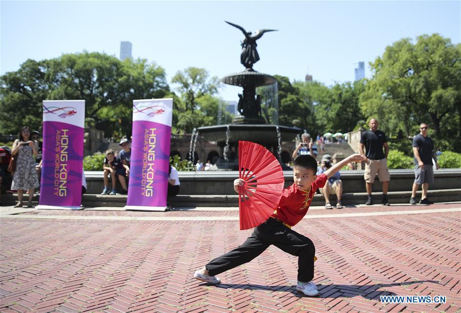 A boy performs martial arts during a traditional dragon boat awakening ceremony for the 28th annual Hong Kong Dragon Boat Festival in New York, the United States, on July 18, 2018. The ceremony marked the start of the training period for over 200 teams competing in this year\'s dragon boat races on Aug. 11 and Aug. 12 in New York. (Xinhua/Wang Ying)