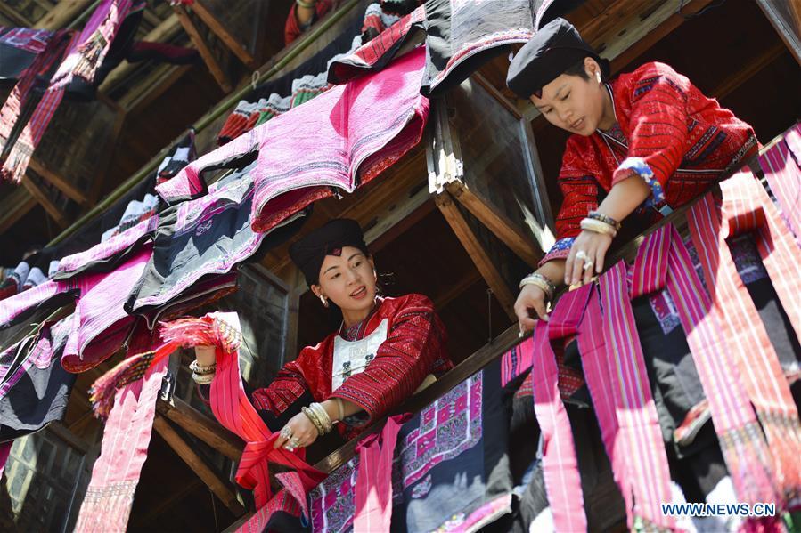 Women of Yao ethnic group present folk costumes in Longji Township of Guilin, south China\'s Guangxi Zhuang Autonomous Region, July 18, 2018. Local people of Yao ethnic group on Wednesday celebrated annual \