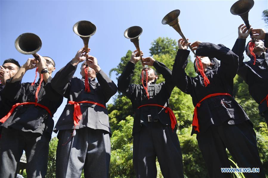 People of Yao ethnic group play suona in Longji Township of Guilin, south China\'s Guangxi Zhuang Autonomous Region, July 18, 2018. Local people of Yao ethnic group on Wednesday celebrated annual \