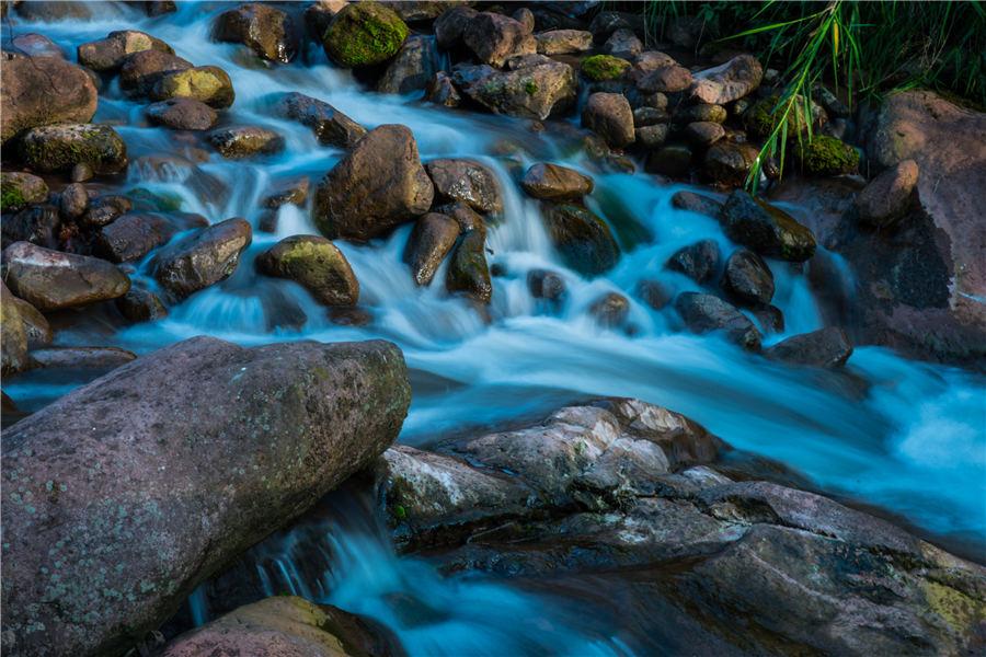 Located in Xuyong county, Southwest China\'s Sichuan Province, Huagaoxi boasts a series of magnificent landscapes such as mountain, hill and valley. Summer is the best time of the year to visit the reserve, which is now a new tourist destination. (Photo by Li Xin/Asianewsphoto)