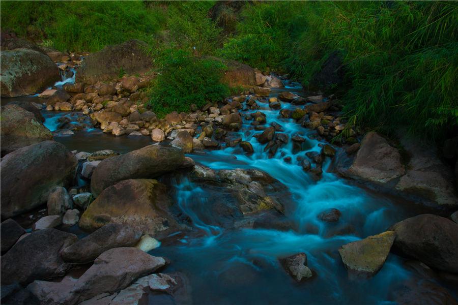 Located in Xuyong county, Southwest China\'s Sichuan Province, Huagaoxi boasts a series of magnificent landscapes such as mountain, hill and valley. Summer is the best time of the year to visit the reserve, which is now a new tourist destination. (Photo by Li Xin/Asianewsphoto)