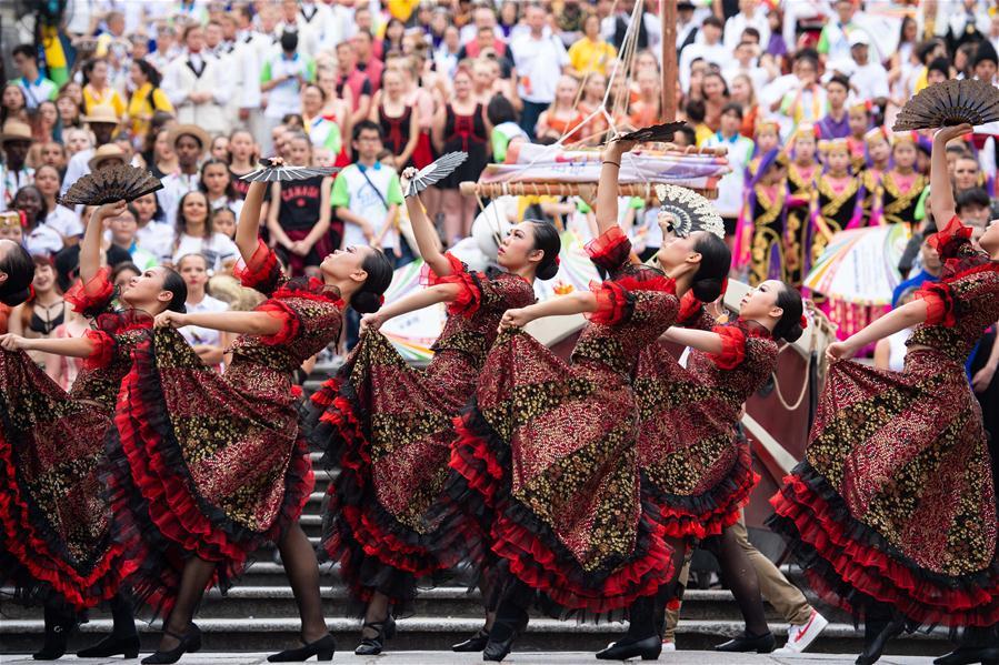 Dancers perform during a parade of an international youth dance festival in Macao, south China, July 21, 2018. A total of 27 dance teams participated in the event here on Saturday. (Xinhua/Cheong Kam Ka)