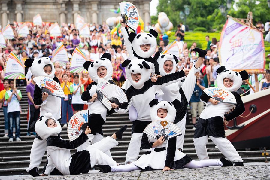 Dancers perform during a parade of an international youth dance festival in Macao, south China, July 21, 2018. A total of 27 dance teams participated in the event here on Saturday. (Xinhua/Cheong Kam Ka)