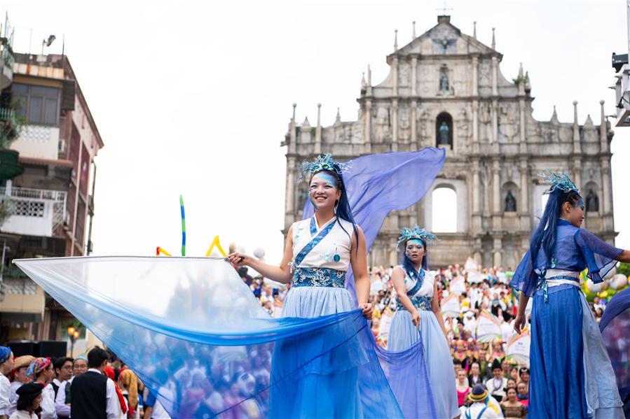 Dancers perform during a parade of an international youth dance festival in Macao, south China, July 21, 2018. A total of 27 dance teams participated in the event here on Saturday. (Xinhua/Cheong Kam Ka)