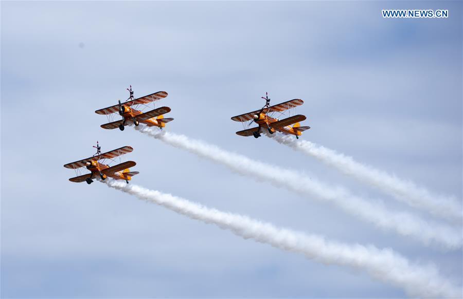 The Breitling Wingwalkers team perform at the Farnborough International Airshow, south west of London, Britain on July 22, 2018. (Xinhua/Han Yan)