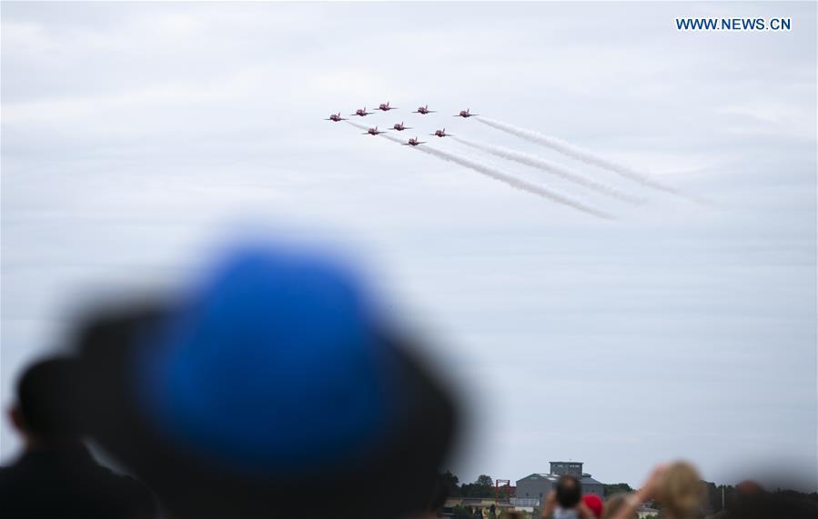 The Red Arrows perform a flypast at the Farnborough International Airshow, south west of London, Britain on July 22, 2018. (Xinhua/Han Yan)