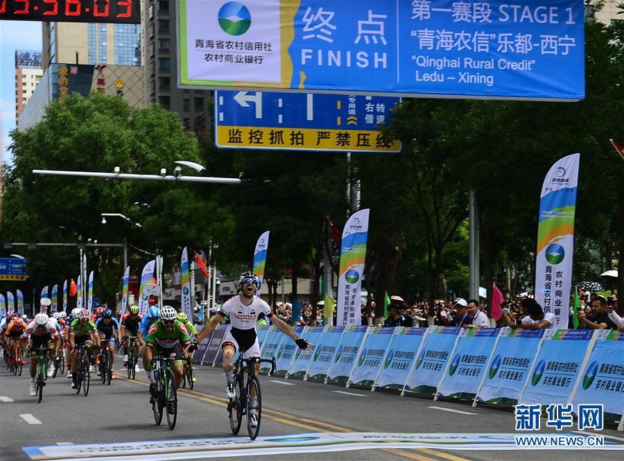 Georgios Bouglas of China\'s Ningxia Sports Lottery Livall Cycling Team (NLC) crosses the finishing line in Xining, Northwest China\'s Qinghai Province, July 22, 2018. (Photo/Xinhua)