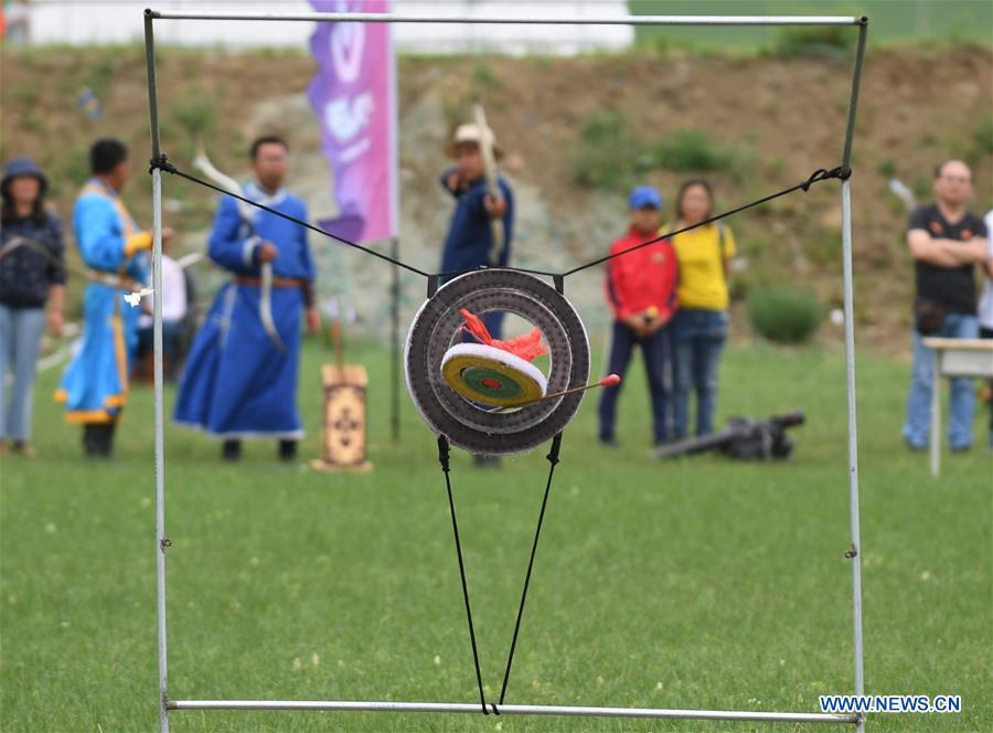 Herdsmen take part in an archery contest during Baima Festival held in West Ujimqin Banner, north China\'s Inner Mongolia Autonomous Region, July 21, 2018. The two-day event is a mass traditional Mongolian festival mainly filled with sports events. (Xinhua/Liu Lei)