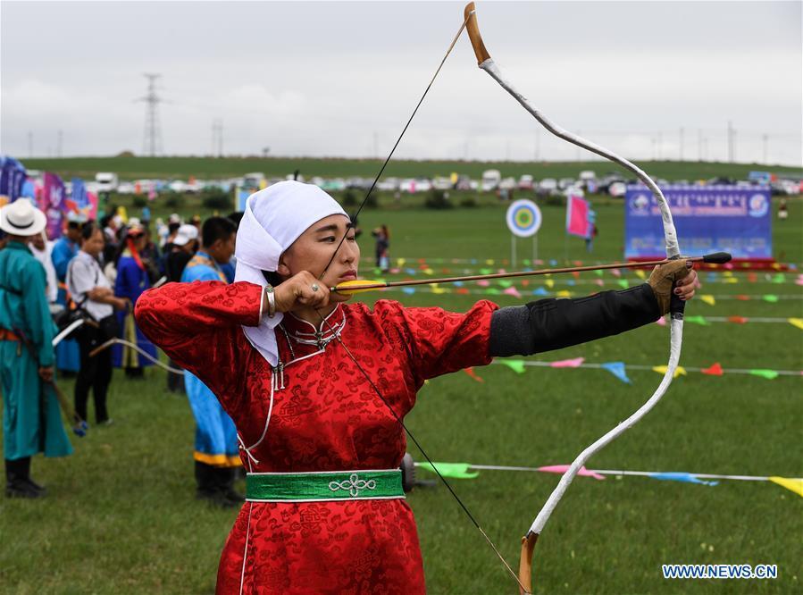 A woman takes part in an archery contest during Baima Festival held in West Ujimqin Banner, north China\'s Inner Mongolia Autonomous Region, July 21, 2018. The two-day event is a mass traditional Mongolian festival mainly filled with sports events. (Xinhua/Liu Lei)