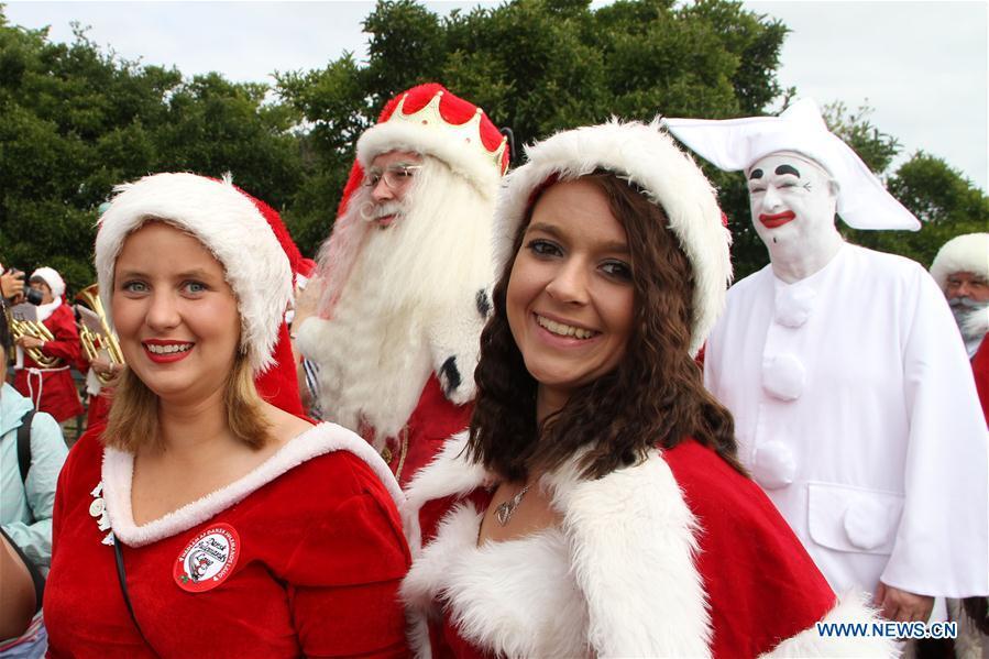 People dressed as Santa Claus gather in Copenhagen, capital of Denmark, on July 23, 2018. The 2018 World Santa Claus Congress kicked off at Bakken amusement park, north of Copenhagen, on Monday. Some 100 Santa Claus from around the globe gathered here in the Danish capital city during the four-day event. (Xinhua/Wu Bo)