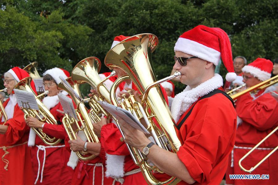 People dressed as Santa Claus perform in Copenhagen, capital of Denmark, on July 23, 2018. The 2018 World Santa Claus Congress kicked off at Bakken amusement park, north of Copenhagen, on Monday. Some 100 Santa Claus from around the globe gathered here in the Danish capital city during the four-day event. (Xinhua/Wu Bo)