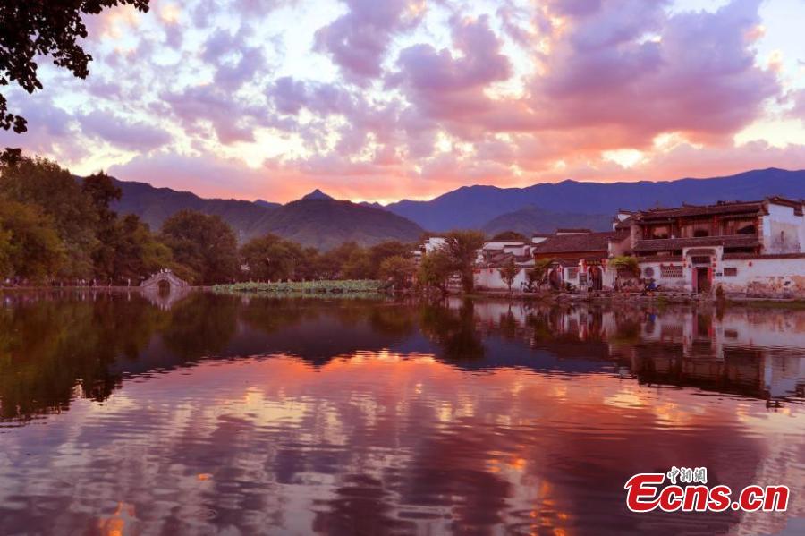 A spectacular view of Nanhu Lake in Hongcun Village at sunset in Huangshan City, Anhui Province. The two traditional villages of Xidi and Hongcun were inscribed as UNESCO World Heritage sites in 2000 as their unique landscapes, architectural forms, decorative features, and construction techniques all retain the original features of Anhui villages from the 14th to 20th centuries. (Photo: China News Service/Shi Guangde)