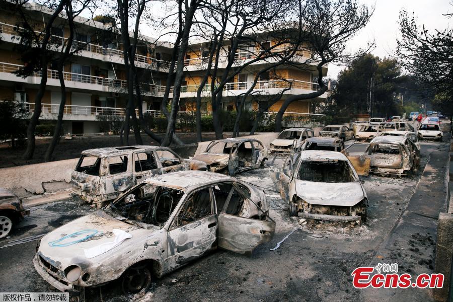 Burned cars are seen following a wildfire at the village of Mati, near Athens, Greece, July 24, 2018. Greece’s prime minister told of the “unspeakable tragedy” the country faced after at least 74 people were killed by wildfires that swept through a resort, trapping people in cars and on the edge of cliffs as others were forced to jump off to survive. (Photo/Agencies)
