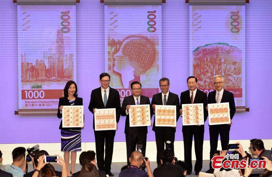 HKMA and bank officials, along with Financial Secretary Paul Chan Mo-po, unveil the notes at a press conference in Hong Kong, July 24, 2018. Hong Kong’s new banknotes will have six advanced security features to prevent counterfeiting, and will showcase the city’s rich natural and cultural heritage. (Photo: China News Service/Zhang Wei)