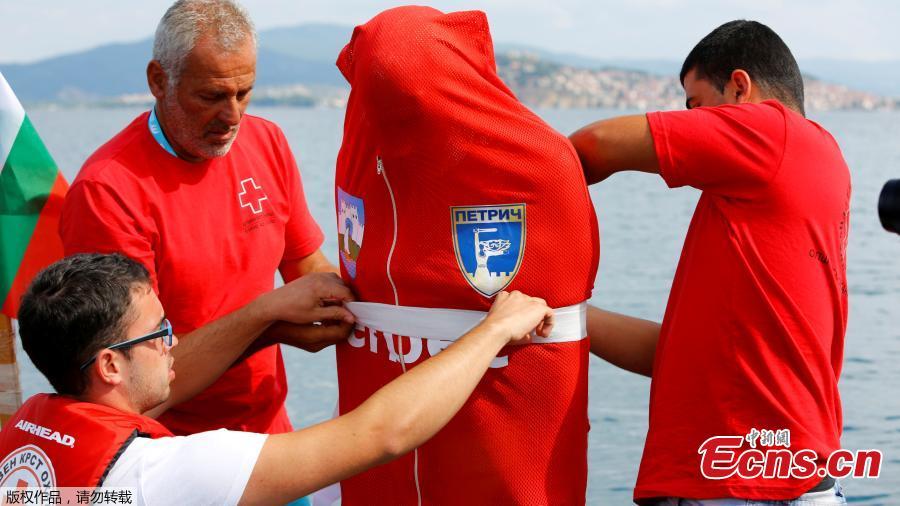 Bulgarian Jane Petkov, 64, wants to set a new Guinness World Record by attempting to swim more than three kilometers at Macedonia\'s Lake Ohrid in a bag with his arms and legs tied up, in Ohrid, Macedonia, July 24, 2018. (Photo/Agencies)